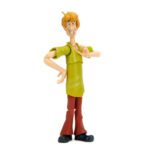 SHAGGY SCOOBY-DOO 1/12 ¡Prepárate para añadir a tu colección al ícono de los misterios y los sándwiches con la figura de acción de Scooby-Doo Shaggy a escala 1:12 de Jada Toys! Esta detallada pieza de colección captura al tranquilo pero adorable Norville "Shaggy" Rogers, el siempre hambriento mejor amigo de Scooby-Doo y miembro clave de Misterios S.A. Ya sea huyendo de fantasmas, resolviendo misterios (casi sin querer) o devorando un sándwich enorme, Shaggy siempre está listo para la aventura, ¡si no le da demasiado miedo! Diseñada por expertos a escala 1:12, esta figura luce la figura espigada de Shaggy, su característica camisa verde y sus clásicos pantalones de campana marrones. Gracias a su impresionante articulación, puedes colocarlo en diversas posturas expresivas, ya sea corriendo tras un fantasma espeluznante o sosteniendo una caja de Scooby Snacks. Este set incluye accesorios para resolver misterios, como cabezas y manos intercambiables para diferentes expresiones de terror y deleite, y una clásica caja de Scooby Snacks. Empaquetada en una caja premium inspirada en la estética clásica de Scooby-Doo, esta figura es imprescindible para los fans de la serie atemporal. Jada Toys mantiene su compromiso con la calidad y la nostalgia, asegurando que Shaggy esté listo para unirse a tu colección. ¡Solo asegúrate de tener muchos bocadillos a mano! Porque, seamos realistas... ¡siempre tiene hambre!
