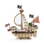 GOING MERRY SET MONTAJE 15,5 CM ONE PIECE WA-GU-MI WOODEN ART. Construye el Going Merry, el primer barco de los Piratas de Sombrero de Paja de "One Piece", y homenajea sus humildes comienzos con este set de montaje de la línea wa-gu-mi Wooden Art de Kito Art. El set está compuesto por 88 piezas de madera contrachapada precortadas por láser y pintadas, distribuidas en 3 paneles de 17x13 cm. Una vez encajadas todas las piezas, el barco tiene unas medidas de 15,5 x 14 x 6 cm. Incluye manual de instrucciones. Se presenta en una caja con ranura para colgar.