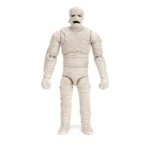 MUMMY OF ANKHA SCOOBY-DOO 1/12 La aterradora Momia de Ankha emerge de la cripta con la figura de acción a escala 1:12 de Scooby-Doo de Jada Toys. Esta escalofriante figura da vida a uno de los villanos más memorables de Mystery Inc. Con su inquietante presencia y la implacable persecución de la pandilla, la Momia de Ankha está lista para atormentar tu colección, ¡a menos, claro, que tengas esa moneda perdida! Diseñada por expertos a escala 1:12, esta figura captura a la perfección las vendas rotas de la Momia (con articulación), los detalles inspirados en el antiguo Egipto y su postura amenazante. Gracias a su excepcional articulación, puedes colocarla en posturas desplomadas, con los brazos extendidos persiguiendo a los niños entrometidos, o arrastrándose entre las sombras al estilo clásico de Scooby-Doo. Este set viene repleto de accesorios misteriosos, como manos intercambiables y una escultura alternativa de la cabeza sin máscara del Dr. Najib con una envoltura de momia adicional, perfecta para crear escenas espeluznantes, como las de la serie. Presentada en una caja premium inspirada en la estética clásica de Scooby-Doo, esta figura es imprescindible para los fans de la serie atemporal. Jada Toys mantiene su compromiso con la calidad y la nostalgia, asegurando que la Momia de Ankha te pondrá los pelos de punta. ¡No olvides la moneda!