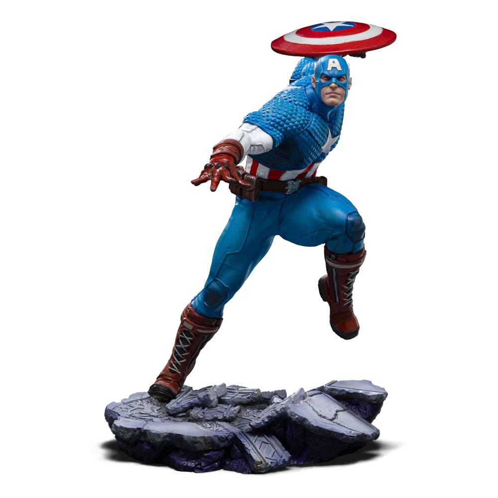 CAPTAIN AMERICA MARVEL ART SCALE 1/10 . Descubre la impresionante estatua de Captain America, parte de la exclusiva colección de Iron Studios. Esta figura a escala 1/10 captura al icónico superhéroe en una posición dinámica, destacando su pose de ataque con su característico escudo en alto. Con una altura aproximada de 22 cm, está fabricada en resistente poliresina, asegurando una gran durabilidad y detalles sorprendentes. Los colores vibrantes en azul, rojo y blanco realzan el diseño clásico del traje de Captain America, con detalles que incluyen texturas realistas en la vestimenta y una base que imita terreno rocoso, añadiendo un toque dramático a la figura. Es una pieza licenciada oficialmente, perfecta para los verdaderos entusiastas de Marvel y los coleccionistas de Avengers.