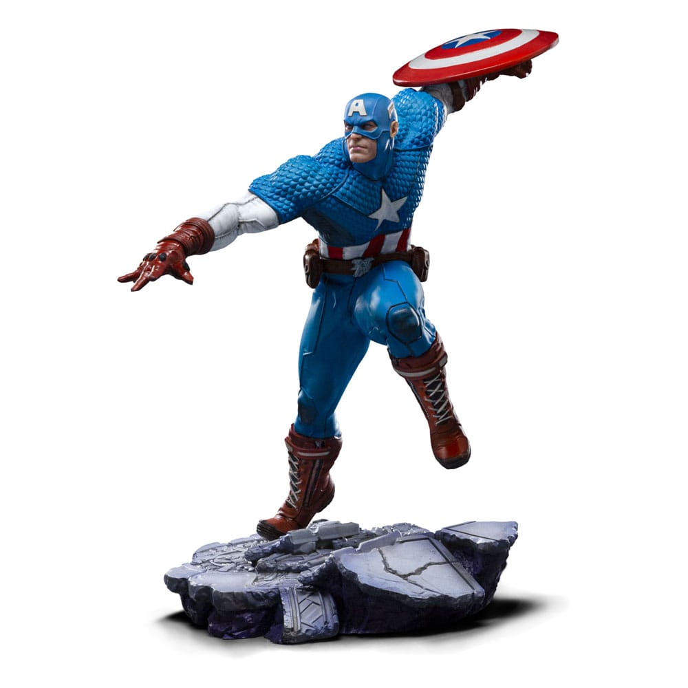 CAPTAIN AMERICA MARVEL ART SCALE 1/10 . Descubre la impresionante estatua de Captain America, parte de la exclusiva colección de Iron Studios. Esta figura a escala 1/10 captura al icónico superhéroe en una posición dinámica, destacando su pose de ataque con su característico escudo en alto. Con una altura aproximada de 22 cm, está fabricada en resistente poliresina, asegurando una gran durabilidad y detalles sorprendentes. Los colores vibrantes en azul, rojo y blanco realzan el diseño clásico del traje de Captain America, con detalles que incluyen texturas realistas en la vestimenta y una base que imita terreno rocoso, añadiendo un toque dramático a la figura. Es una pieza licenciada oficialmente, perfecta para los verdaderos entusiastas de Marvel y los coleccionistas de Avengers.