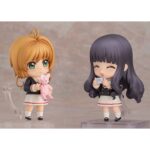 TOMOYO DAIDOUJI TOMOEDA JUNIOR HIGH UNIFORM CARDCAPTOR SAKURA: CLEAR CARD NENDOROID. Good Smile Company lanza la figura de la colección Nendoroid de Tomoyo Daidouji con su uniforme escolar, basada en el anime "Cardcaptor Sakura: Clear Card". Esta figura articulada de aproximadamente 10 cm de altura incluye 3x placas faciales (sonriente, alegre e ilusionada), 1x cámara de vídeo, 1x bolso, 1x smartphone y otras piezas opcionales para recrear diversas poses. Incluye base transparente para su exhibición.