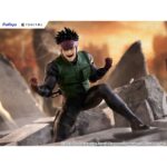 YU OMNIAE SPRIGGAN TENITOL. Furyu incorpora a su línea Tenitol la figura de Yu Ominae, protagonista del anime "Spriggan". Destaca por una pose dinámica y por su musculatura detallada que refleja con precisión las fibras y relieves del cuerpo. El traje A-M presenta arrugas realistas que refuerzan el efecto tridimensional y transmiten una fuerte presencia visual. La figura está pintada, fabricada en PVC y se presenta completamente montada. Mide aproximadamente 13,5 cm de alto e incluye base para su exposición.