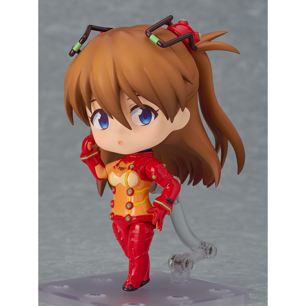 Shikinami asuka langley plugsuit version evangelion 2. 0 you can not advence nendoroid. Good smile presenta la figura articulada nendoroid de asuka shikinami langley con su traje de pruebas, inspirada en la película de animación "evangelion: 2. 0 you can (not) advance" (perteneciente a la tetralogía "rebuild of evangelion"). Incluye: 3x placas faciales intercambiables (sonrojada, guiñando un ojo y sonriente),1x teléfono móvil y otras piezas opcionales para diferentes poses. Mide aproximadamente 10 cm de alto y viene con base expositora transparente incluida.