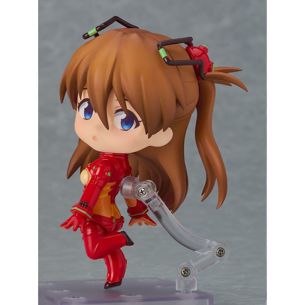 Shikinami asuka langley plugsuit version evangelion 2. 0 you can not advence nendoroid. Good smile presenta la figura articulada nendoroid de asuka shikinami langley con su traje de pruebas, inspirada en la película de animación "evangelion: 2. 0 you can (not) advance" (perteneciente a la tetralogía "rebuild of evangelion"). Incluye: 3x placas faciales intercambiables (sonrojada, guiñando un ojo y sonriente),1x teléfono móvil y otras piezas opcionales para diferentes poses. Mide aproximadamente 10 cm de alto y viene con base expositora transparente incluida.