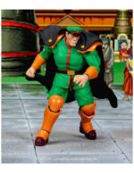 M BISON DELUXE PLAYER 2 EXCLUSIVE ULTRA STREET FIGHTER II. Jada Toys presenta la figura de Bison. Tiene una altura de 17 cm y está basada en el personaje de los videojuegos "Street Fighter". Incluye 3x cabezas extras, 2x pares de manos, 1x efecto de agua, 2x efectos de fuego y 1x base con soporte articulado. Adéntrate en el mundo de la dominación definitiva con la figura de acción a escala 1:12 de M. Bison (Exclusiva de Jugador 2 Deluxe) de Ultra Street Fighter II de Jada Toys. Con su color Verde Jugador 2, esta versión exclusiva del despiadado líder de Shadaloo aporta una nueva amenaza y una energía electrizante al combate. Ya sea desatando su Psycho Power o flotando amenazante sobre sus enemigos, M. Bison es la encarnación de la maldad pura e implacable. Este set premium está repleto de accesorios potentes: (4) esculturas de cabeza completas, incluyendo dos expresiones totalmente nuevas exclusivas de este lanzamiento, (2) esculturas de cabeza adicionales para tu M. Bison Jugador 1, (3) pares de manos, accesorio de cuerpo en llamas con base de exhibición, pieza de efecto Psycho Crusher, pieza de efecto Psycho Power y base. UNIDADES LIMITADAS.