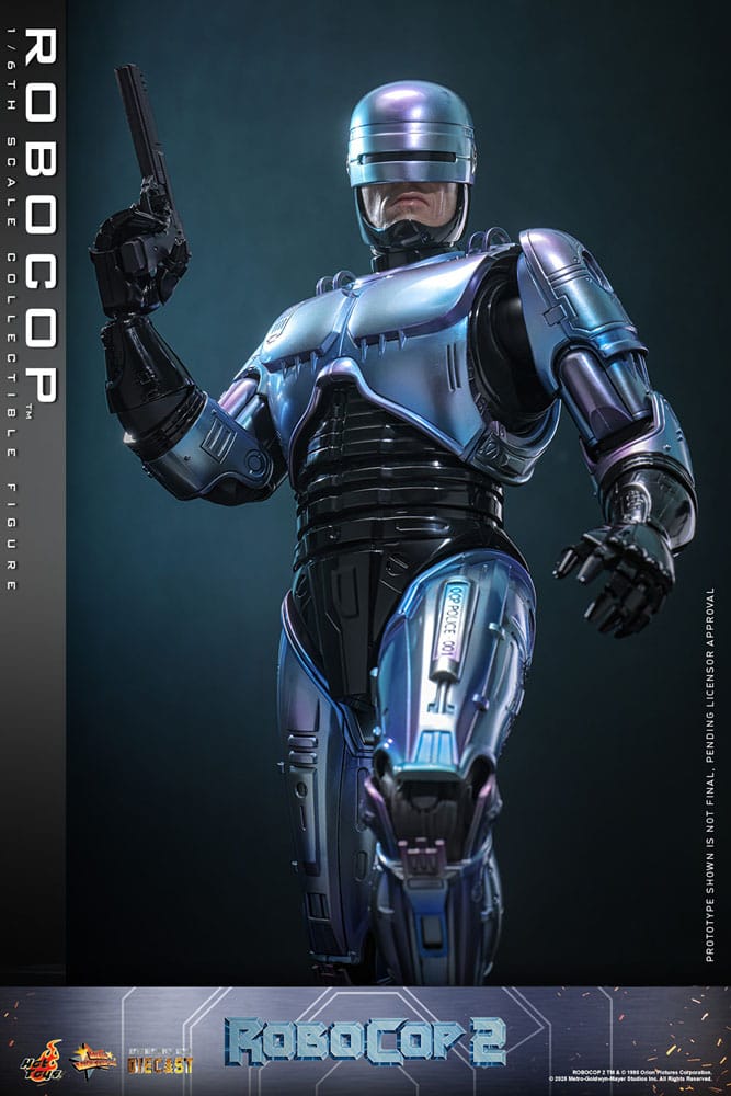 Robocop 2 movie masterpiece hot toys 1/6.  es considerada una película clásica de acción y ciencia ficción, muy querida por muchos fans. La historia sigue a robocop, un agente de la ley cíborg que antes era un humano llamado alex murphy. Tras ser brutalmente asesinado en acto de servicio, se transforma en un poderoso robot de alta tecnología con habilidades avanzadas. Posee superfuerza, visión mejorada y un compromiso inquebrantable con la ley. En "robocop 2", robocop continúa protegiendo a los ciudadanos de detroit. Se enfrenta a una nueva amenaza cuando un ejecutivo rebelde de ocp desarrolla una versión más avanzada y malévola de robocop, lo que supone un grave desafío para su misión y la seguridad de la ciudad.