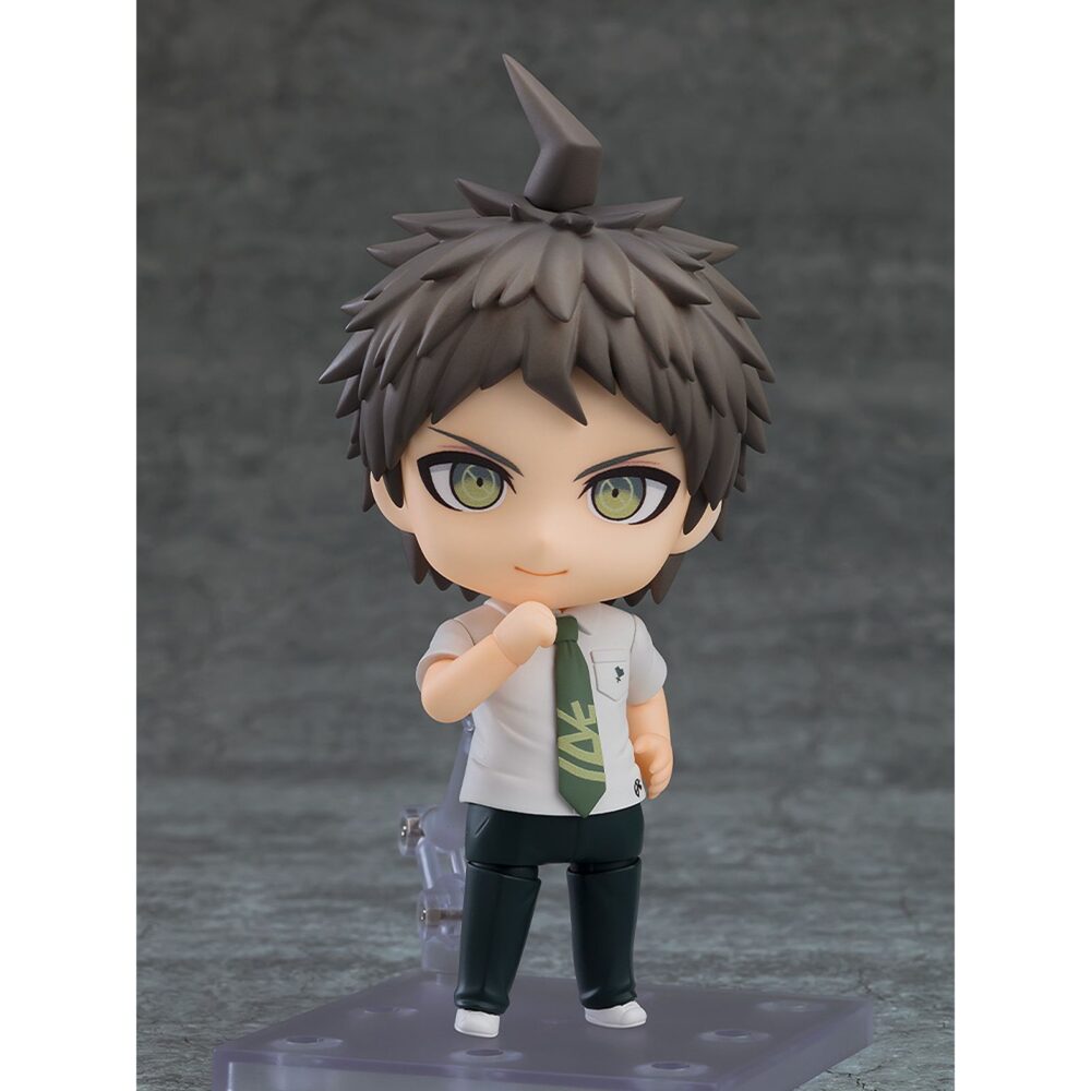 Hajime hinata danganronpa 1-2 reload nendodoid. Good smile incorpora a su colección nendoroid la figura de hajime hinata, el estudiante que aparece en el videojuego "danganronpa 1&2 reload". Mide aproximadamente 10 cm e incluye 3x placas faciales intercambiables (sonriente, acusador y asustado), 1x lámina de contador y otras partes opcionales para poses. Cuenta con base cuadrada transparente y soporte para su exposición.