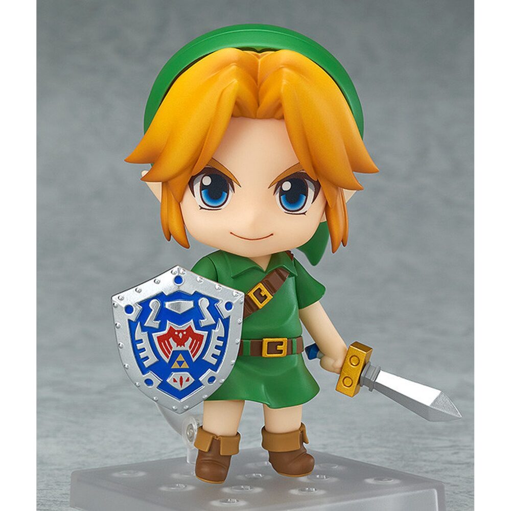 Link the legend of zelda majora’s mask nendoroid. Good smile company vuelve a introducir en su colección nendoroid la figura articulada de link basada en el protagonista del videojuego "the legend of zelda: majora's mask 3d" para nintendo 3ds. Esta edición cuenta con una selección de accesorios mayor de lo habitual: 2x placas faciales intercambiables (sonriente y gritando), 1x escudo del héroe, 1x espada kokiri, 1x poción de salud, 1x capucha de conejo, 1x máscara deku, 1x máscara goron, 1x máscara zora, 1x máscara de majora y 1x hada tatl con soporte. Mide aproximadamente 10 cm de altura y está fabricada en pvc y abs. Se presenta en caja con ventana y cuenta con una base cuadrada transparente con soporte articulado para exposición.