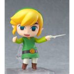 LINK THE LEGENG OF ZELDA THE WIND WAKER NENDOROID. Good Smile Company vuelve a incorporar a su colección Nendoroid la figura articulada de Link basada en el protagonista del videojuego "The Legend of Zelda: The Wind Waker HD" para Nintendo Wii U. La figura incluye 4x placas faciales intercambiables (seria, sonriente, combate y nervioso), 1x batuta, 1x escudo, 1x espada, 1x efecto de ataque y 1x contenedor de corazón con soporte. Mide aproximadamente 10 cm de altura y cuenta con una base cuadrada transparente con soporte para su exposición.