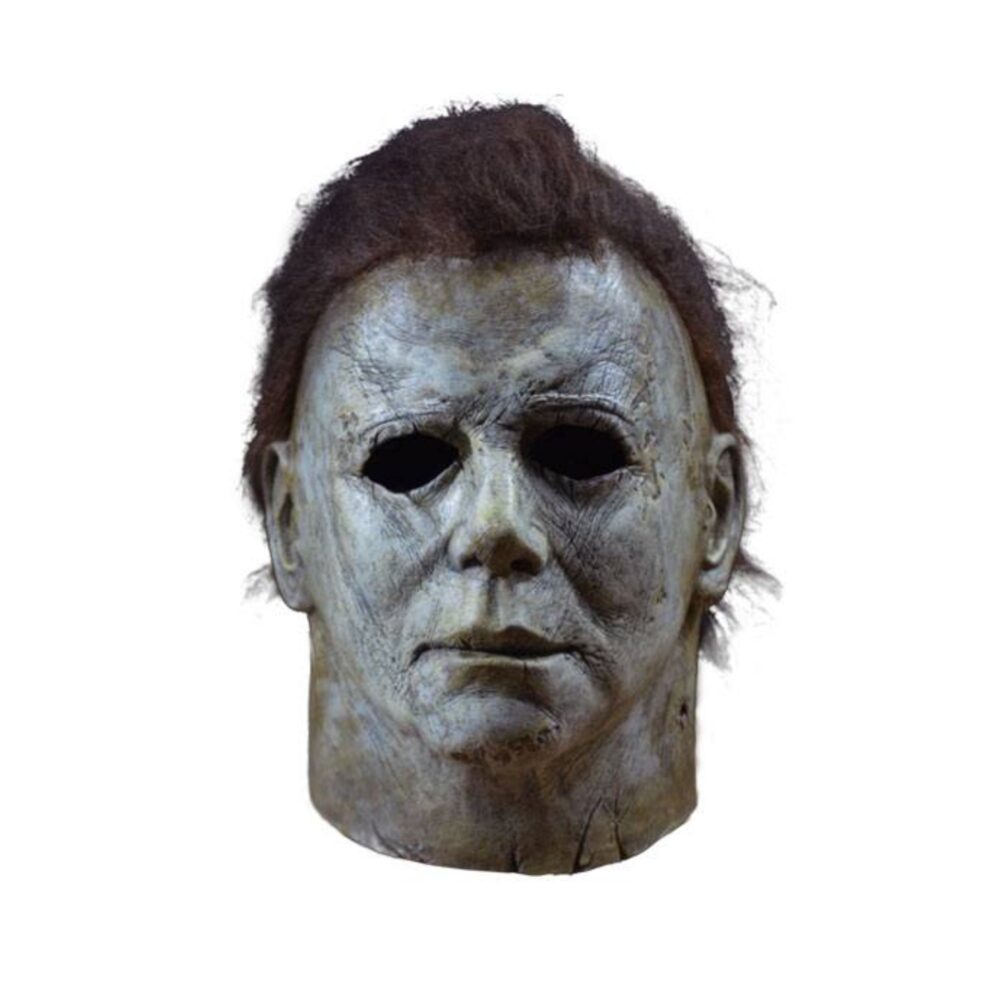 MICHAEL MYERS MASK HALLOWEEN (2018). ¡Trick or Treat Studios se enorgullece de presentar la máscara de Michael Myers con licencia oficial de la película Halloween 2018! Esta máscara viene directamente del maestro de la película, es una réplica exacta de la máscara que lleva Michael Myers en Halloween 2018. Máscara de látex con pelo sintético, talla única. Modelo con licencia oficial.
