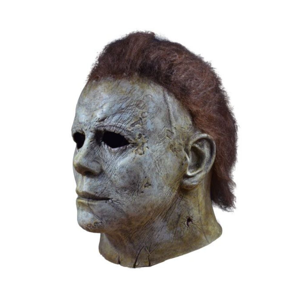 MICHAEL MYERS MASK HALLOWEEN (2018). ¡Trick or Treat Studios se enorgullece de presentar la máscara de Michael Myers con licencia oficial de la película Halloween 2018! Esta máscara viene directamente del maestro de la película, es una réplica exacta de la máscara que lleva Michael Myers en Halloween 2018. Máscara de látex con pelo sintético, talla única. Modelo con licencia oficial.