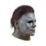 MICHAEL MYERS MASK HALLOWEEN (2018). ¡Trick or Treat Studios se enorgullece de presentar la máscara de Michael Myers con licencia oficial de la película Halloween 2018! Esta máscara viene directamente del maestro de la película, es una réplica exacta de la máscara que lleva Michael Myers en Halloween 2018. Máscara de látex con pelo sintético, talla única. Modelo con licencia oficial.
